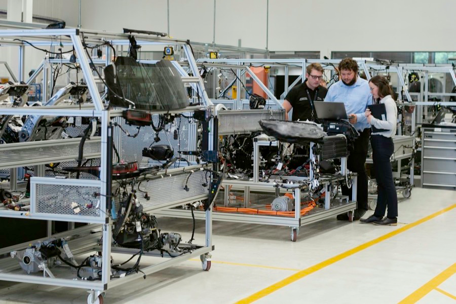 Engineers working on a factory production floor